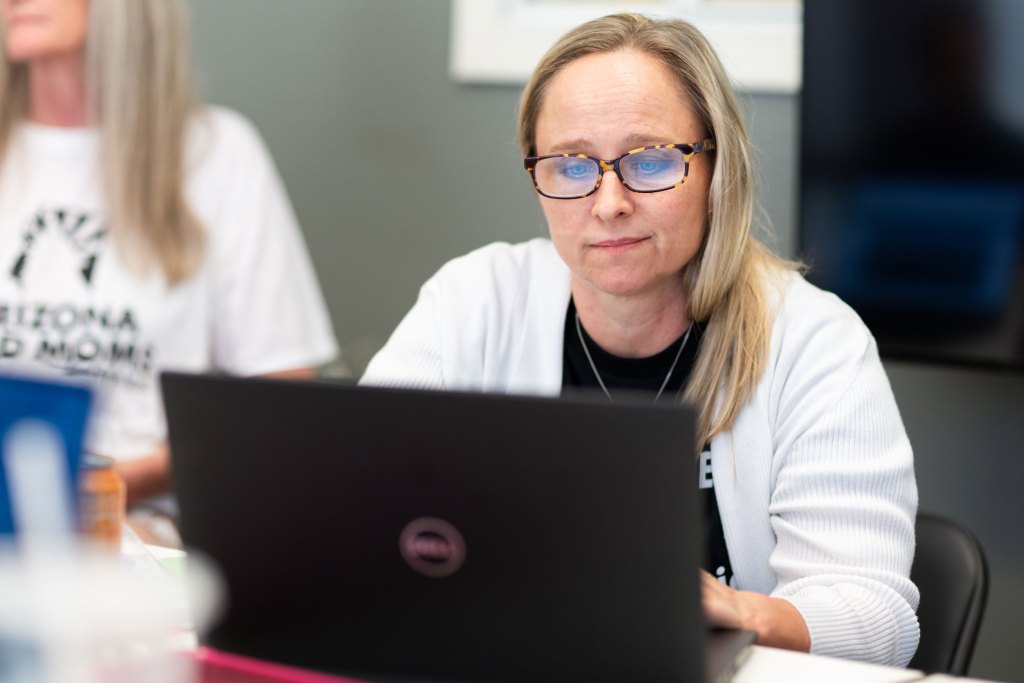 Rachel Streiff works in a shared Phoenix office for Arizona Mad Moms on May 27, 2026. Photo by Caitlin O'Hara, special to AZCIR
