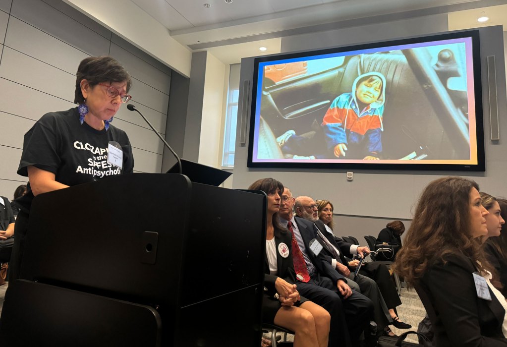 Lisa Maria Castellanos, whose son had his first trial of clozapine while incarcerated, speaks during the public comment period at the FDA advisory committee meeting. Photo by Alexandra Markovich | AZCIR